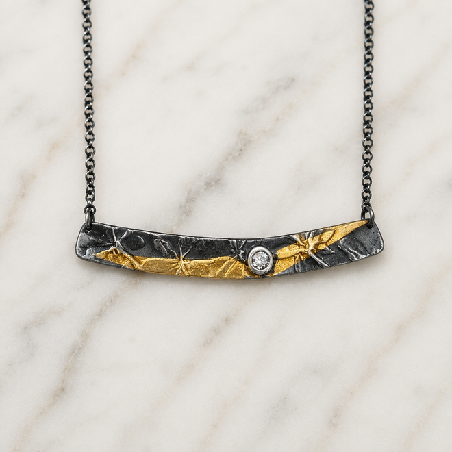 One-of-a-kind handmade horizontal bar necklace in oxidized sterling silver with 24k gold and cubic zirconia handcrafted in Sedona Arizona