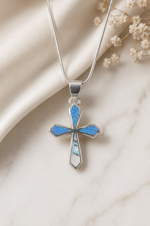 Handmade Navajo sterling silver cross necklace featuring vibrant Blue Opal and Mother of Pearl stone inlay, authentic Native American handcrafted jewelry.