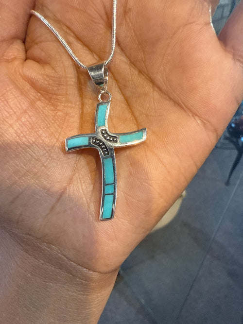 Handmade Navajo Arizona Blue Turquoise cross necklace in sterling silver, authentic Native American jewelry handcrafted by a Navajo artisan.