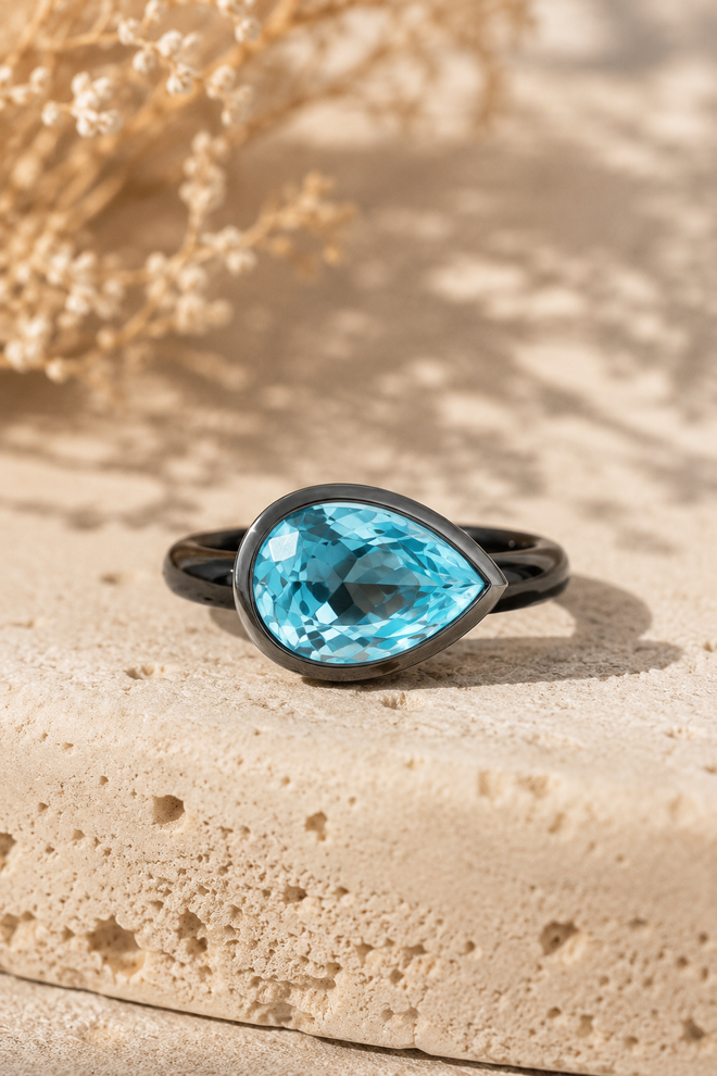 One-of-a-kind handmade pear-shaped Blue Topaz ring featuring an 11x8mm natural Blue Topaz bezel set in oxidized sterling silver.