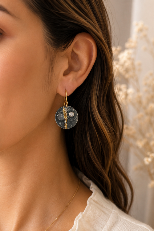 One-of-a-kind handmade sterling silver earrings with 24k gold accents and cubic zirconia handcrafted in Sedona Arizona