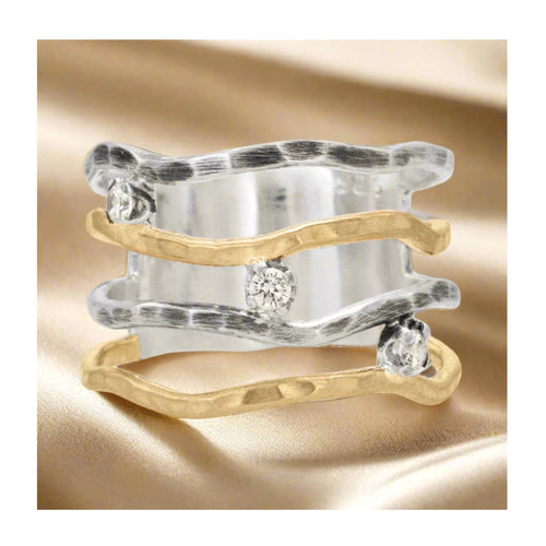 Handmade sterling silver and gold wave ring with white zirconia accents