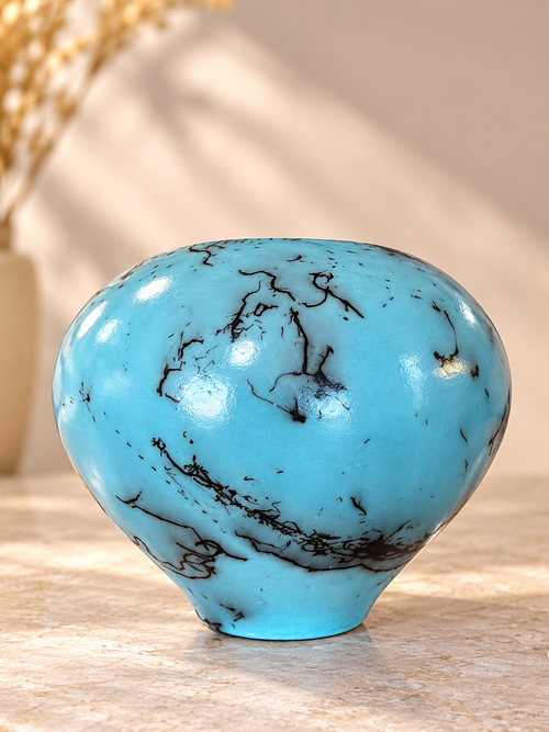 Handmade turquoise raku seed pot with small top opening and one-of-a-kind horsehair markings