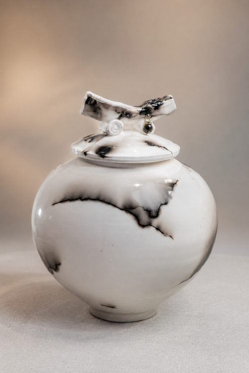 Handmade white horsehair pottery lidded vessel with natural black markings