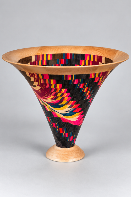 One-of-a-kind Vortex Bowl by Jack Dohallow, featuring vibrant multicolored spiral wood patterns, hand-turned pedestal base and natural wood rim.