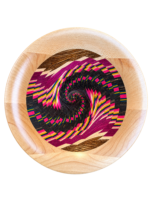 Overhead view of Jack Dohallow's Vortex Bowl revealing a mesmerizing spiral of pink, yellow, blue and contrasting natural woods created through segmented woodturning.