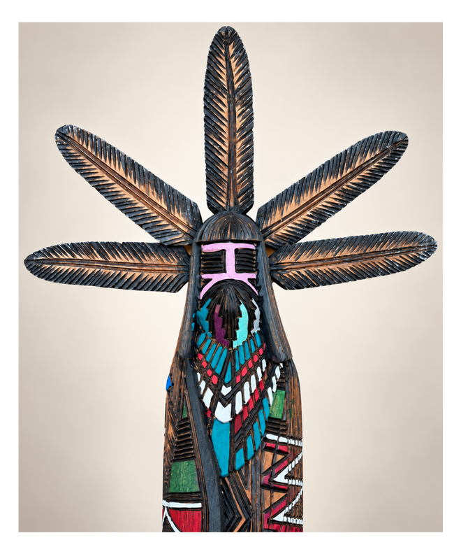 Close-up of Jerold Guy Navajo Kachina showing five carved feathers, burned-line patterns and hand-painted details