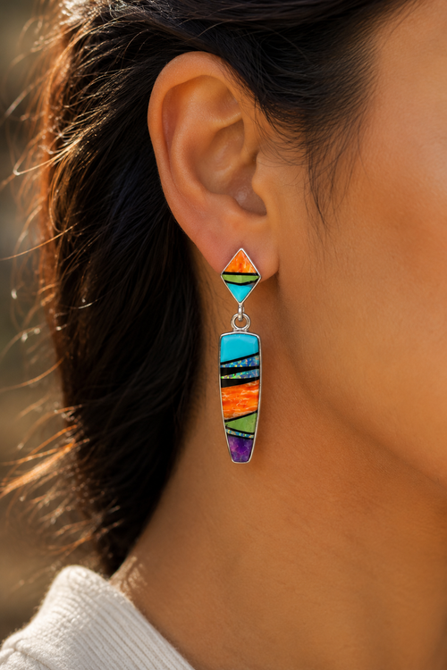 Kingman turquoise multistone inlay drop earrings shown on ear in sterling silver