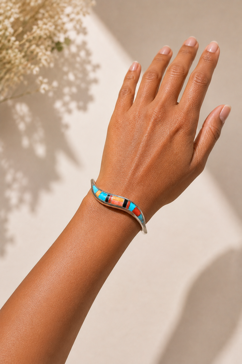 Kingman turquoise and spiny oyster multistone inlay sterling silver cuff bracelet shown on wrist