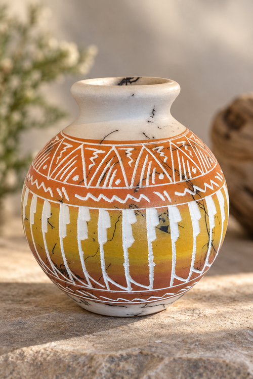 Hand-carved Navajo horsehair pottery vessel by Larry Livingston with geometric designs and warm earth tones