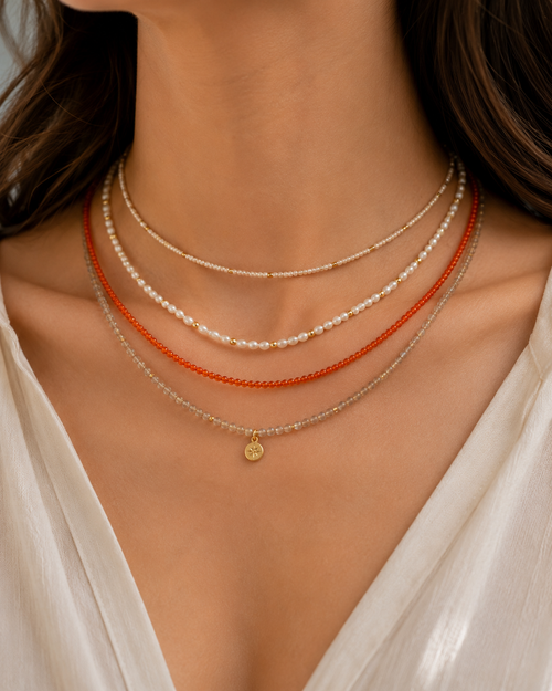 layer beaded necklaces on a model