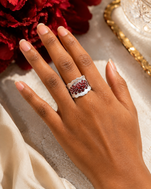 Luxury designer sterling silver garnet statement ring featuring vibrant natural garnets in a bold handcrafted cocktail ring design.