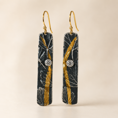 Luxury handmade sterling silver bar earrings with gold accents and sparkling cubic zirconia artisan jewelry from Raku Gallery
 in Jerome Arizona
