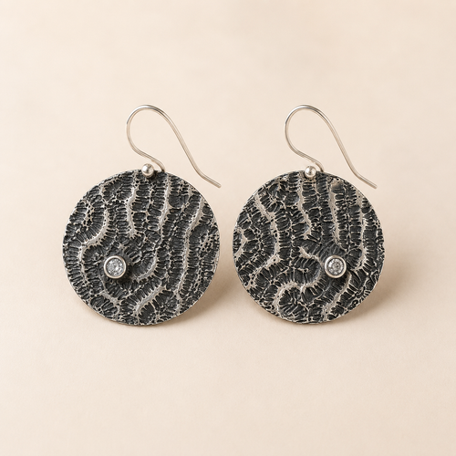 Luxury handmade fine jewelry earrings in sterling silver artisan design available at Raku Gallery
 in Jerome Arizona