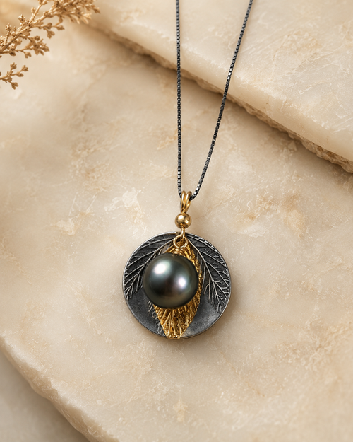 Luxury handmade Tahitian pearl necklace in oxidized sterling silver and 24k gold handcrafted in Sedona Arizona
