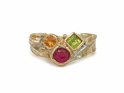 Luxury handcrafted 14k gold ruby sapphire and peridot ring made in Sedona Arizona