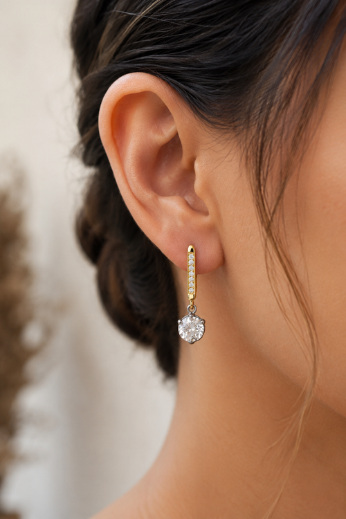 Elegant two-tone crystal drop earrings in gold-plated sterling silver and oxidized sterling silver with sparkling white crystals, perfect for everyday wear and special occasions.