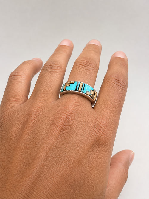 Kingman turquoise sterling silver ring with Picture Jasper and Black Jade shown on a man's hand