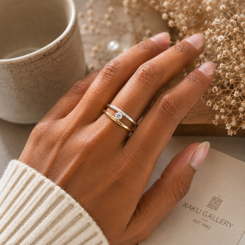 Minimalist mixed metal ring shown on hand