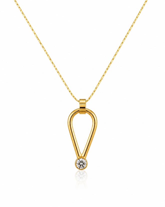 Modern gold vermeil pendant necklace featuring a cubic zirconia accent on a 17-inch chain.