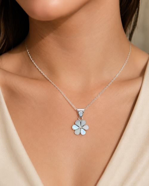 Mother of pearl flower necklace worn on neck with delicate sterling silver chain and floral pendant