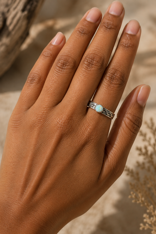 Handmade Native American cultured opal sterling silver ring shown on hand with 3/16 inch band