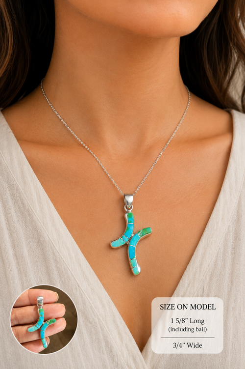 Native American Sonoran turquoise inlay cross pendant in sterling silver shown worn as a necklace