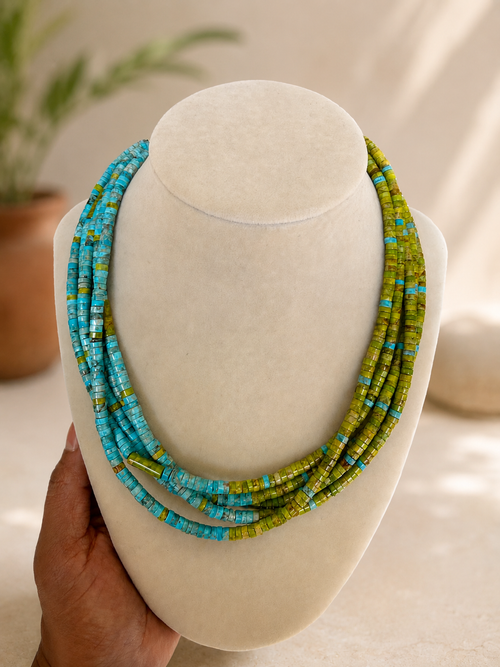 Native American five-strand turquoise and apple coral heishi bead necklace by a Kewa Pueblo artist