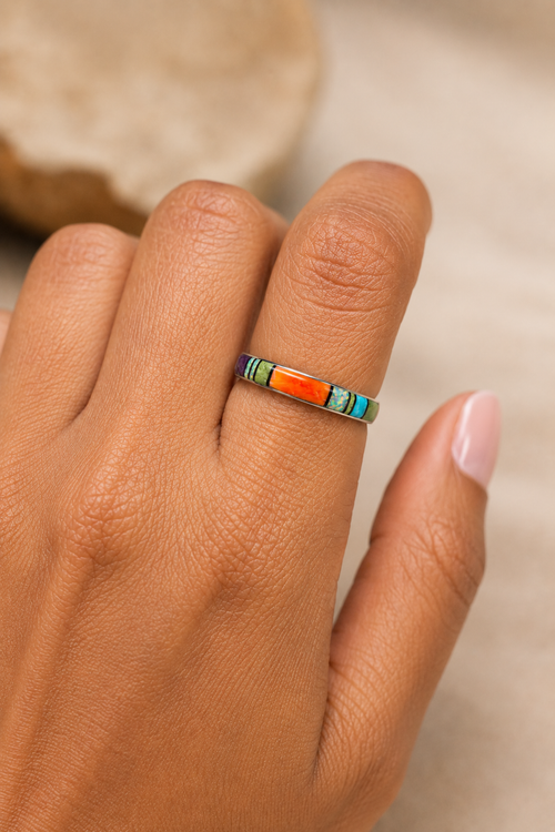 Navajo multistone inlay ring shown on hand with orange spiny oyster, opal and gaspeite