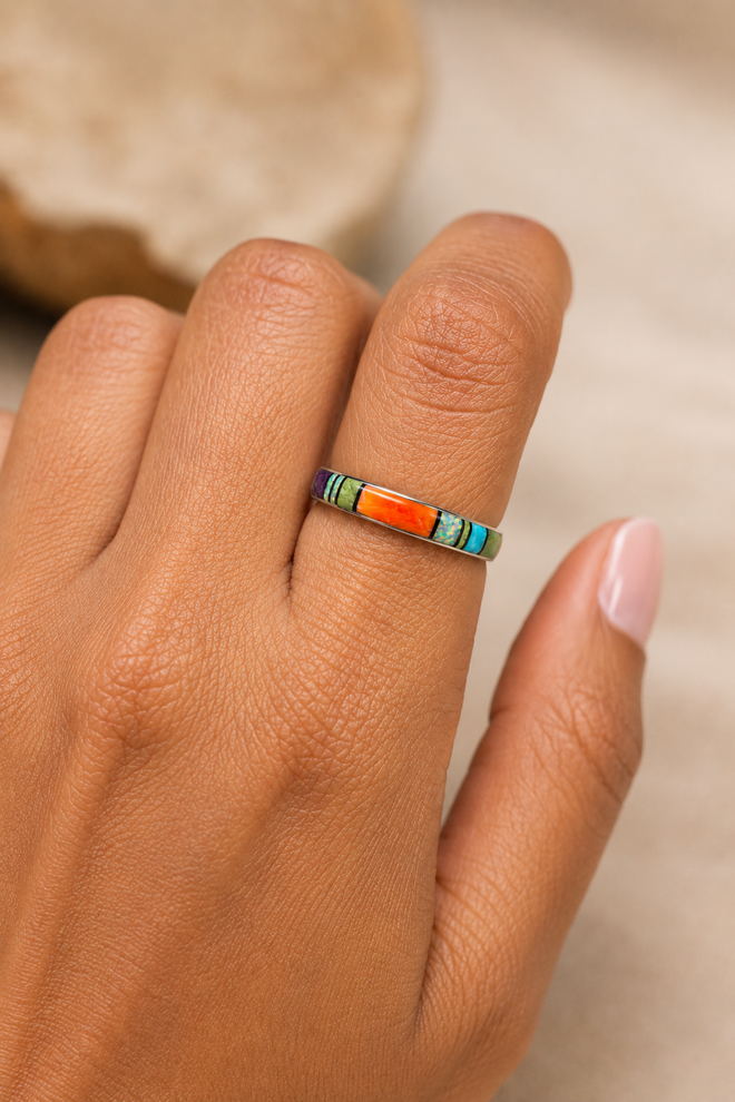 Navajo multistone inlay ring shown on hand with orange spiny oyster, opal and gaspeite