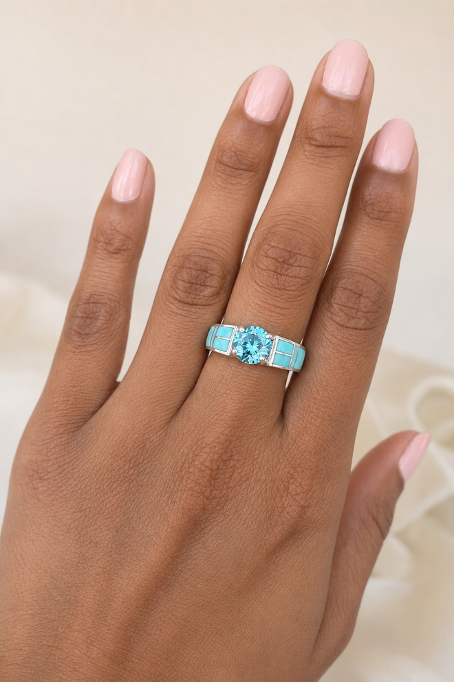 Navajo sterling silver ring with Kingman turquoise inlay and round blue topaz center stone