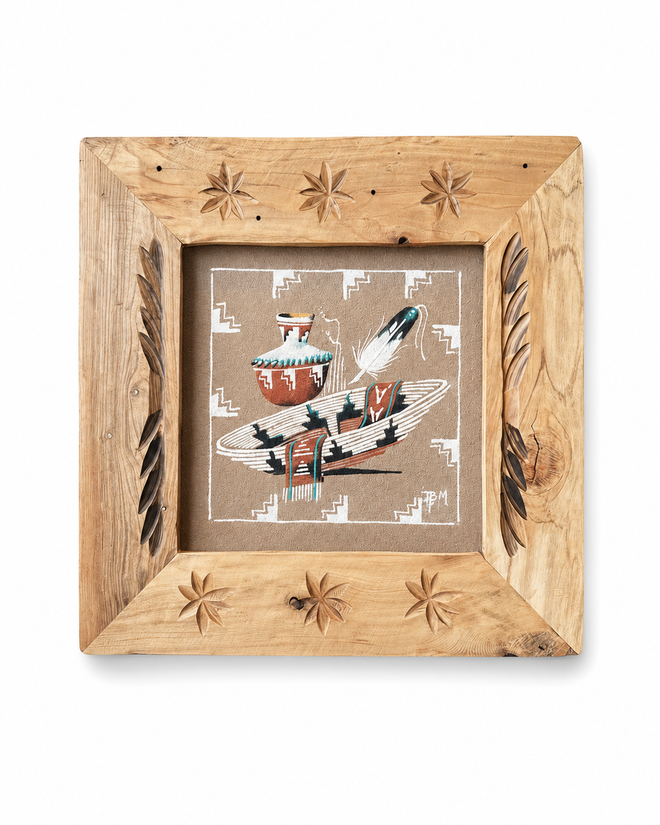 Navajo sand painting by Ben Mitchell in carved wooden frame featuring pottery, feather, and basket design