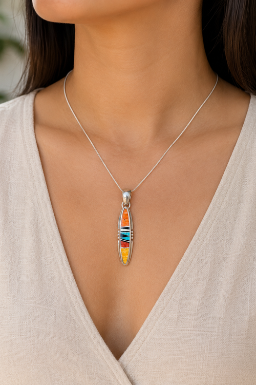 Navajo Spiny Oyster and turquoise inlay pendant shown worn on a silver chain
