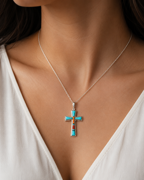 Navajo Kingman turquoise and spiny oyster cross pendant worn on a silver chain