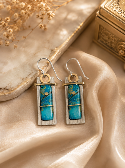 One-of-a-kind blue art glass earrings handcrafted with sterling silver and brass, unique artisan statement earrings.