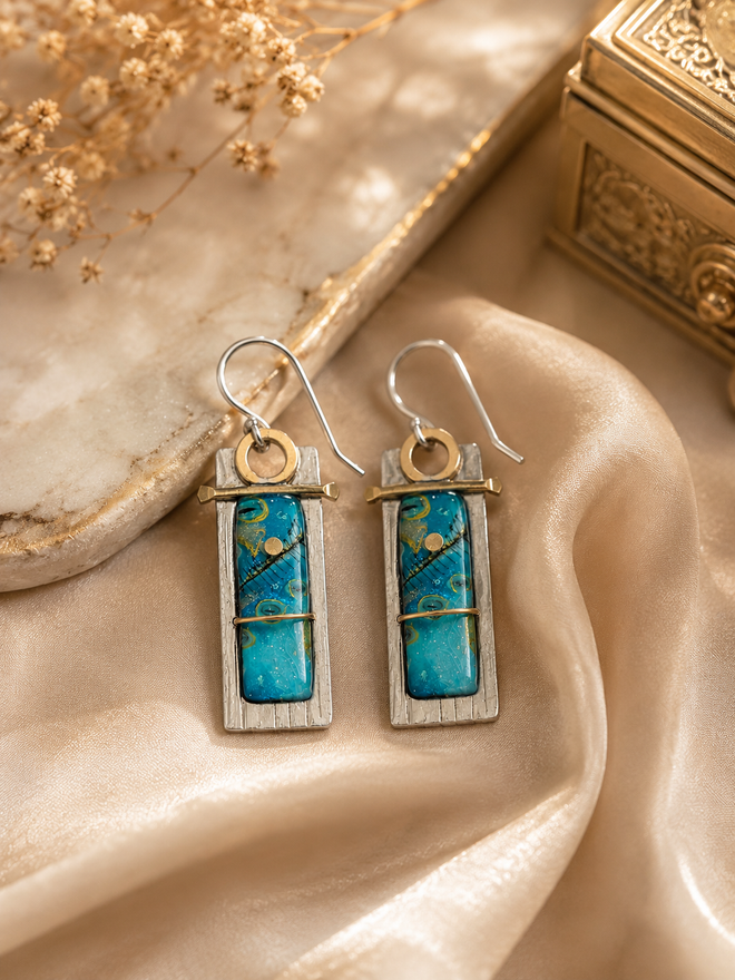 One-of-a-kind blue art glass earrings handcrafted with sterling silver and brass, unique artisan statement earrings.