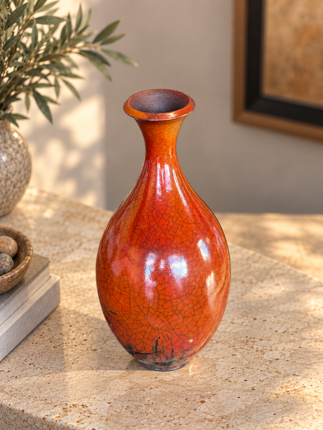 One-of-a-kind ferric chloride Raku pottery by Bob Smith with orange-red tones, smoke markings and natural crackle patterns