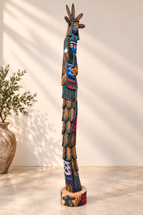 Side profile of one-of-a-kind Jerold Guy Navajo Kachina with intricate burned patterns and hand-painted cottonwood