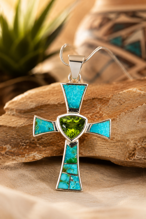 One-of-a-kind Navajo sterling silver cross pendant with genuine Sonoran Gold Turquoise and Peridot displayed in an elegant Southwestern setting. Handmade Native American Christian jewelry from Raku Gallery.