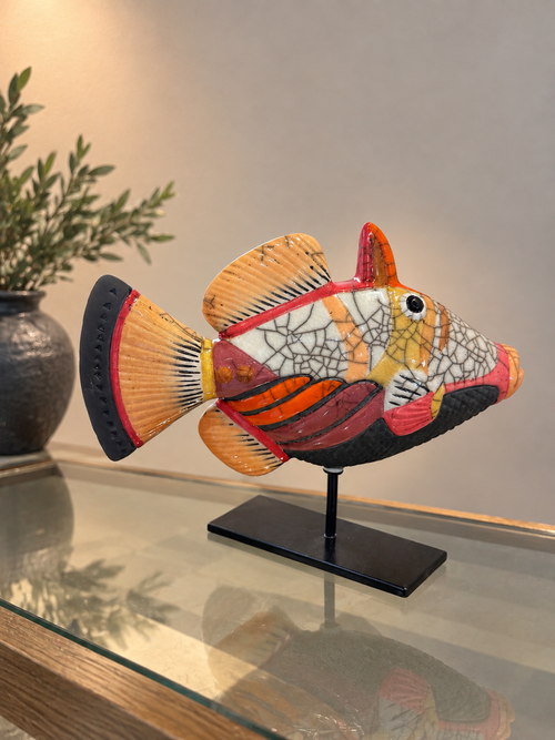 One-of-a-kind Raku ceramic fish sculpture on black stand showing detailed handmade glaze and pattern