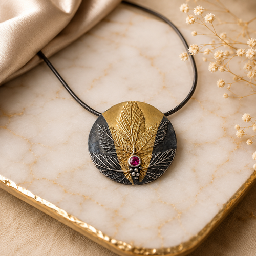 One-of-a-kind ruby pendant necklace handcrafted in oxidized sterling silver with 24k gold accents in Sedona Arizona