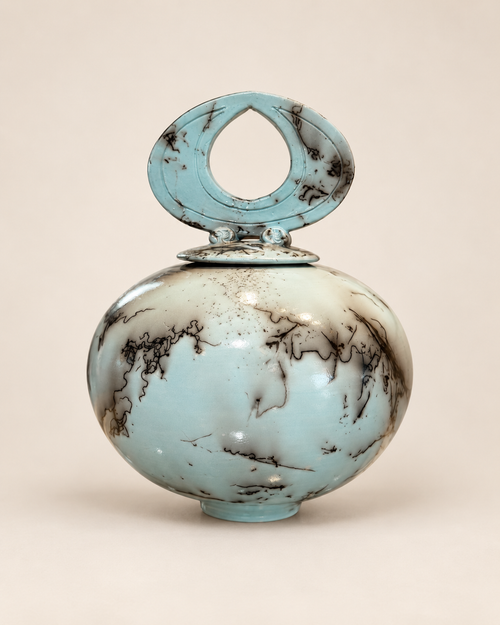 One-of-a-kind turquoise raku pot with decorative lid and distinctive horsehair firing design