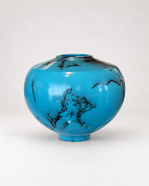 One-of-a-kind turquoise raku pottery vessel with horsehair firing patterns and rounded silhouette