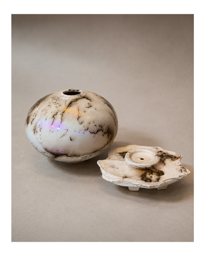 Opalescent white horsehair Raku vessel resting on its handmade ceramic altar base