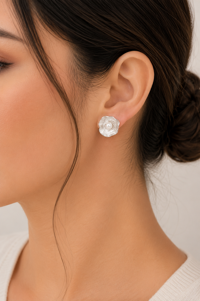 sterling silver flower earrings with genuine freshwater pearls, handcrafted artisan jewelry inspired by nature featuring a sculptural floral design and elegant contemporary style.