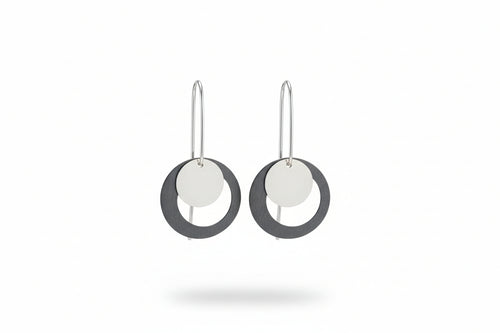Oxidized and polished sterling silver circle earrings with elongated ear wires