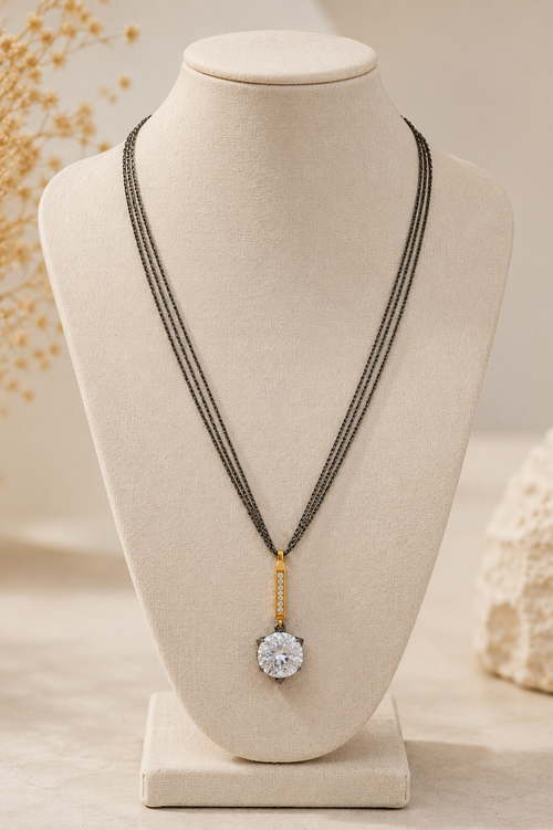Handcrafted oxidized sterling silver layered necklace featuring a 12mm round crystal pendant, gold plated sterling silver CZ bar, and adjustable 18–20 inch chain.