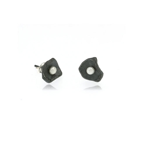 Oxidized sterling silver freshwater pearl stud earrings for women with handcrafted organic petal design and contemporary artisan style.