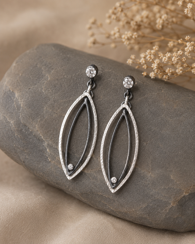 One-of-a-kind oxidized sterling silver and sterling silver marquise earrings with cubic zirconia accents, handcrafted artisan jewelry from Raku Gallery in Jerome Arizona.
