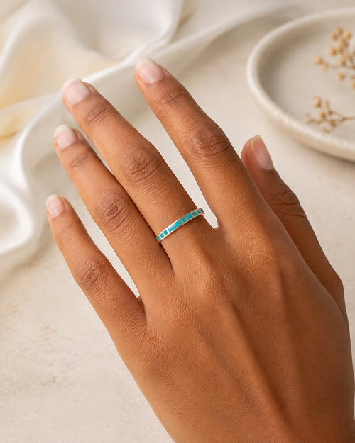 Petite chrysocolla sterling silver ring worn on hand showing slim stacking band design